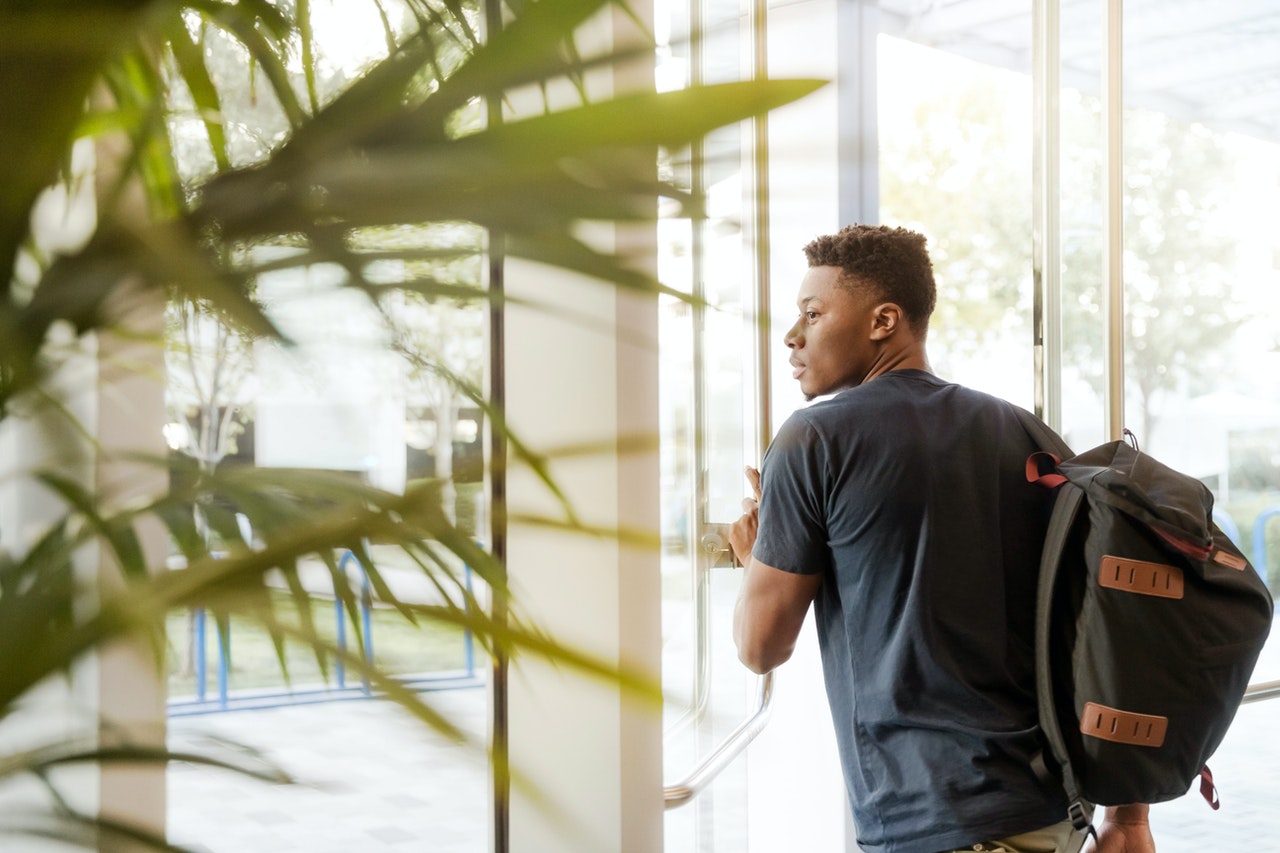 student exiting a building