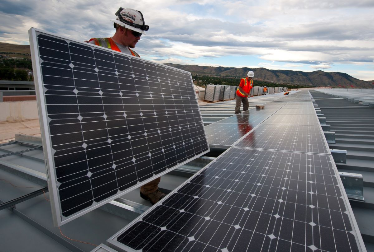 man installing solar panel