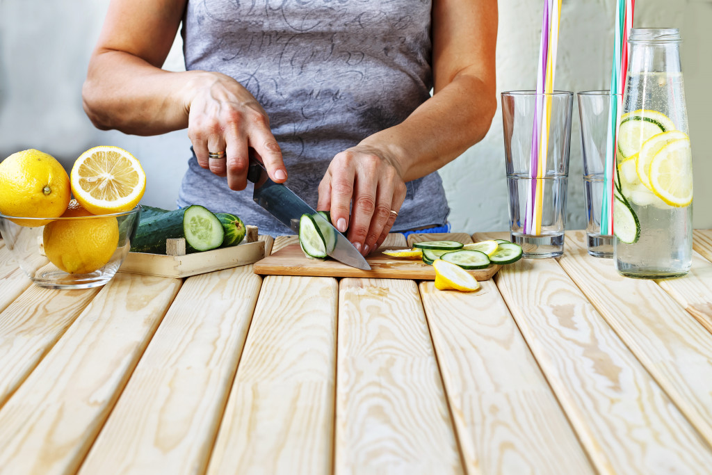 woman cutting fruits