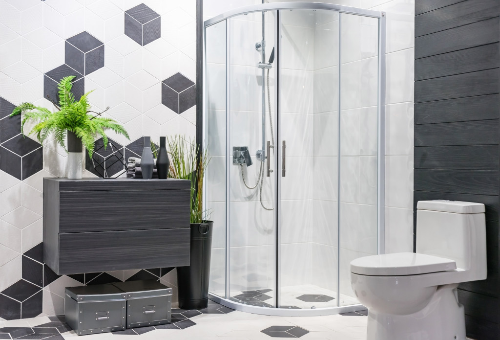 a bathroom with minimalist style and a glass shower enclosure