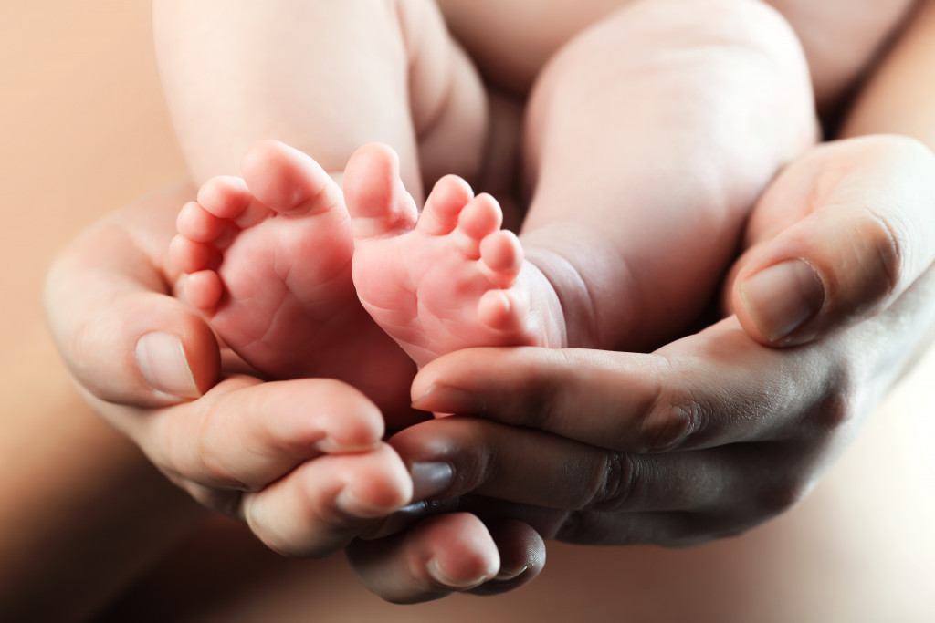 Baby's foot in mother hands