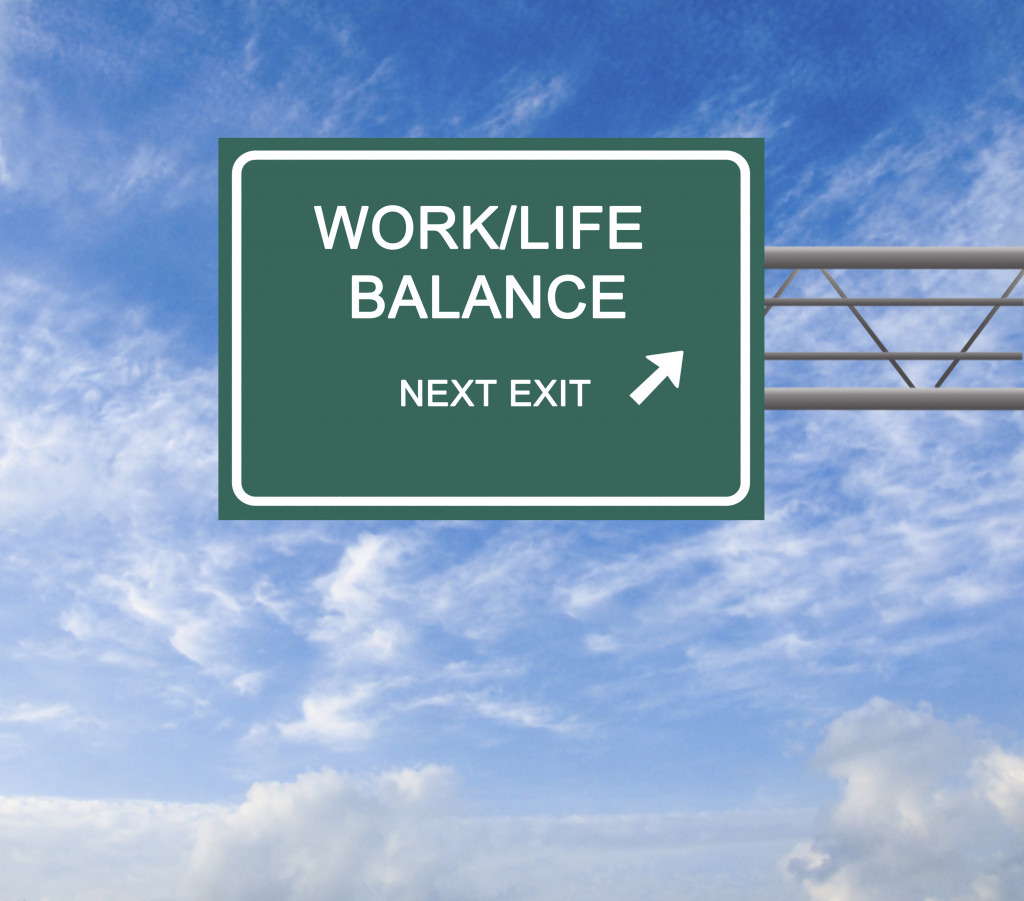 Sign showing work life balance as next exit