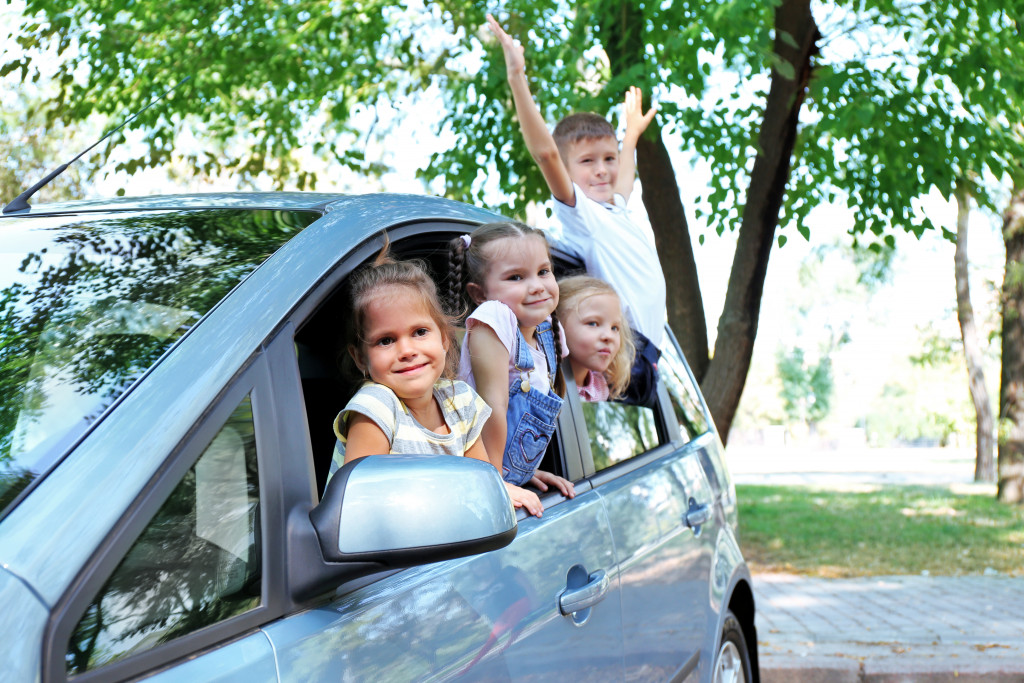 Children inside family car ready to go