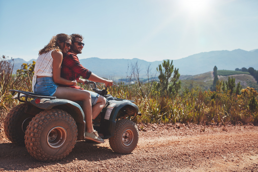 a couple using an ATV on an off-road adventure