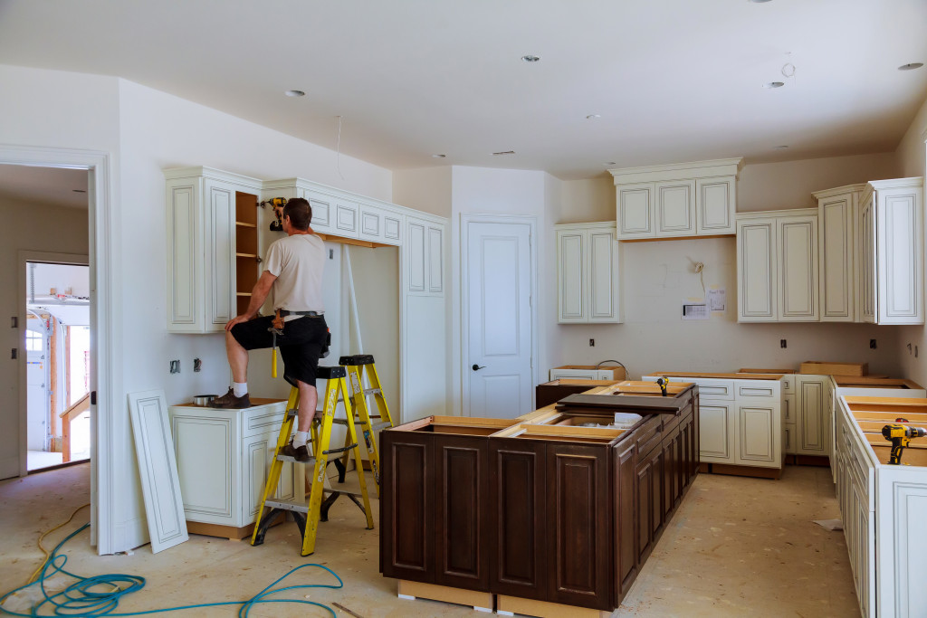 a man making improvements in the kitchen