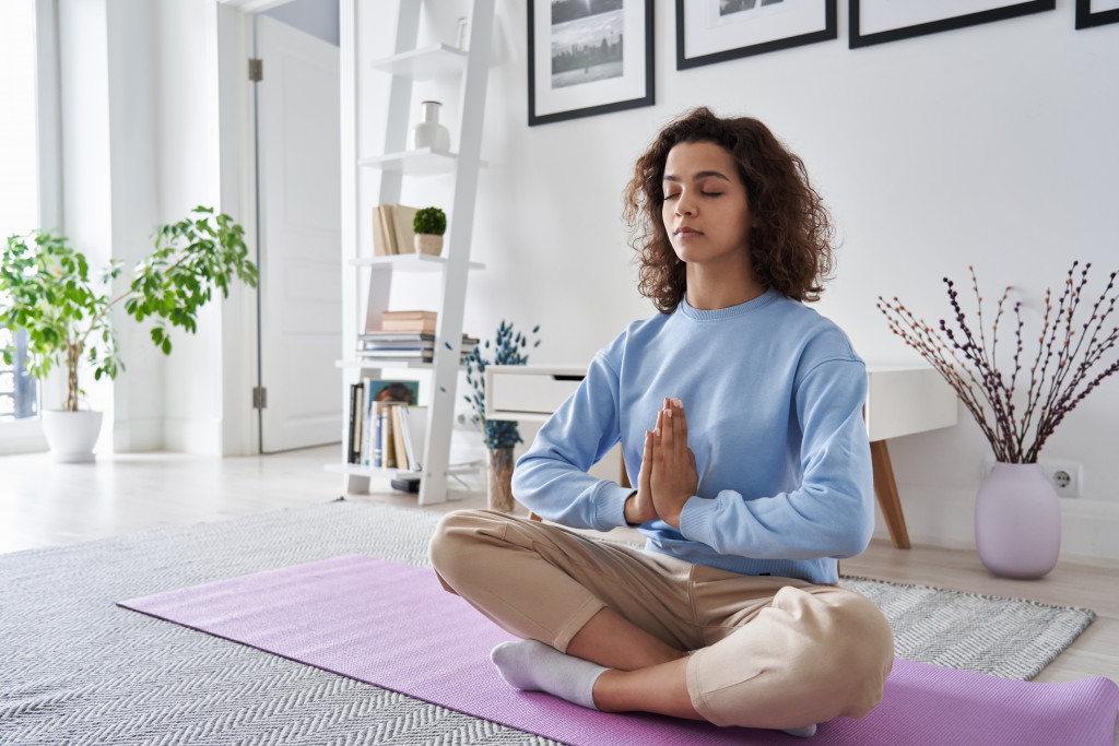 a woman doing yoga poses at home