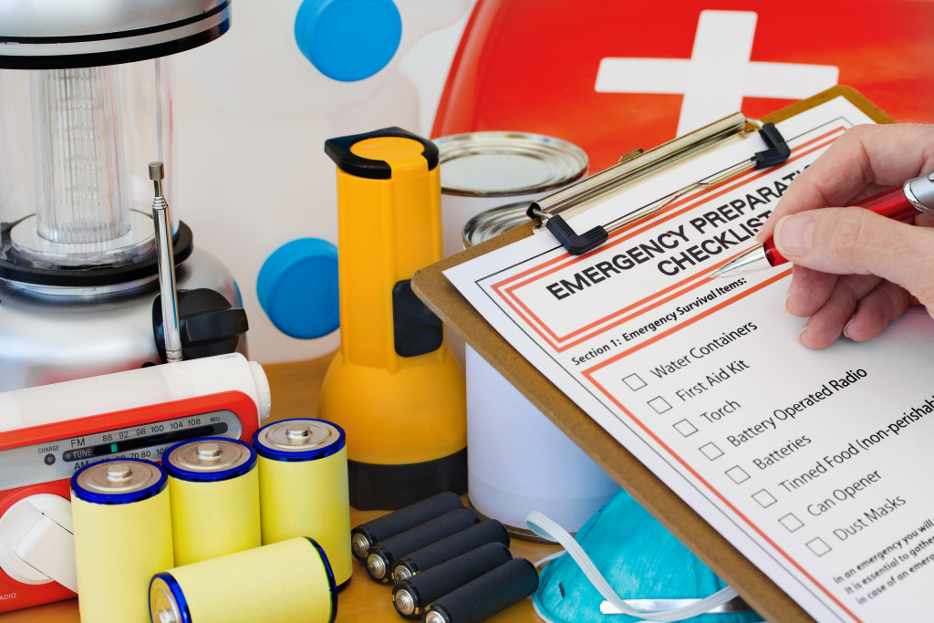 emergency preparation list with flashlight and batteries