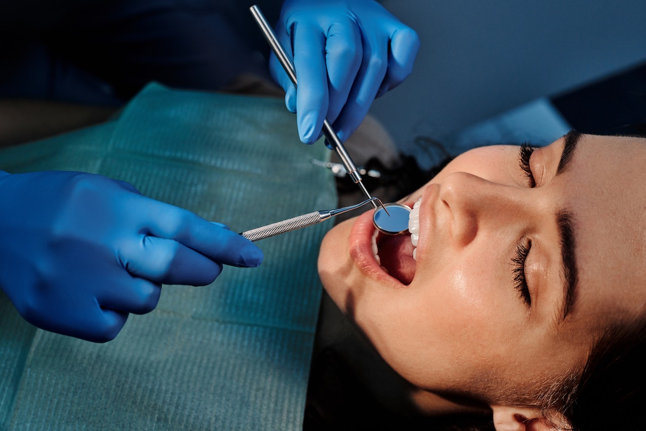 a woman having dental cleaning