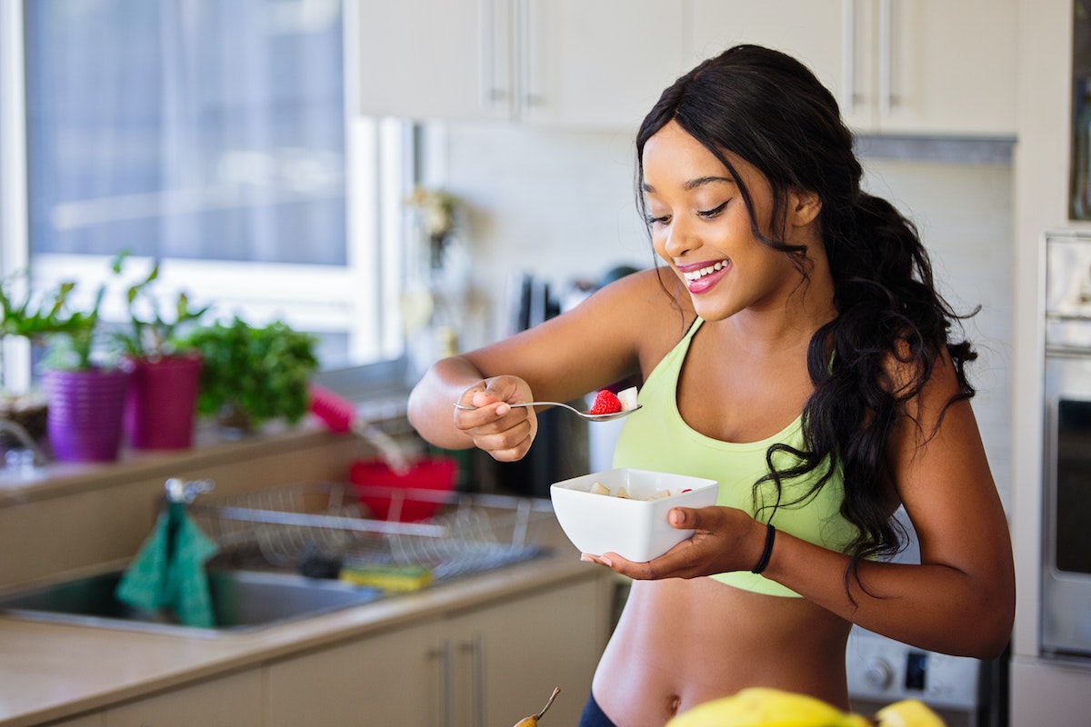 a woman eating healthy food