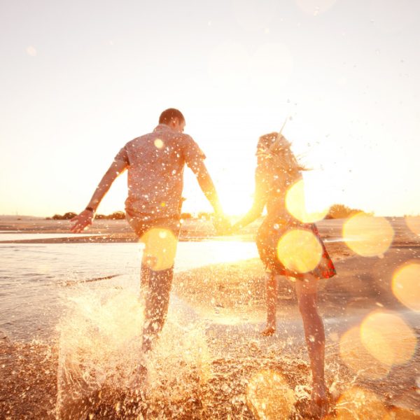 couple enjoying the beach area together