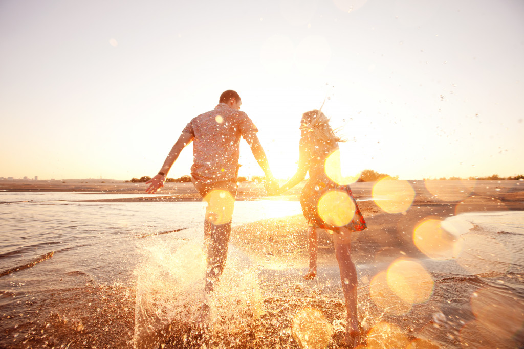 couple enjoying the beach area together