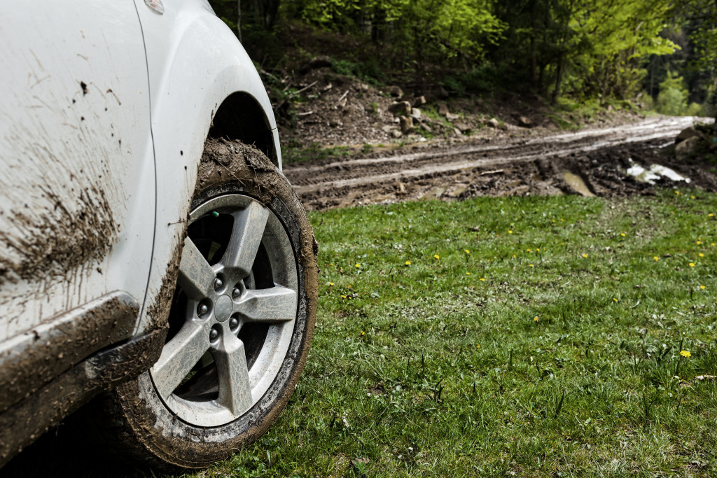 SUV wheel closeup in muddy road