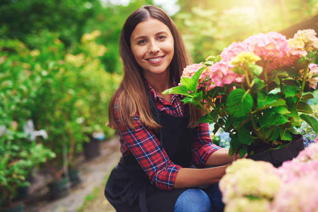 woman holding flowers