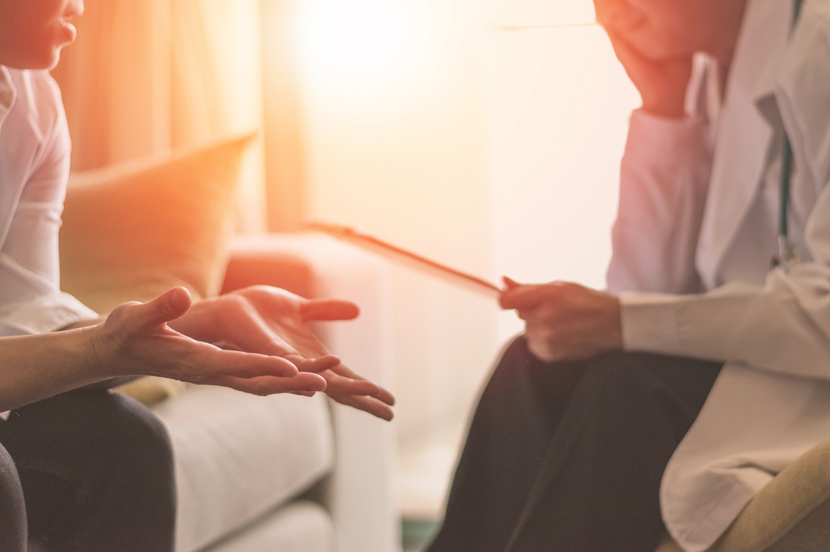 therapist speaking with patient