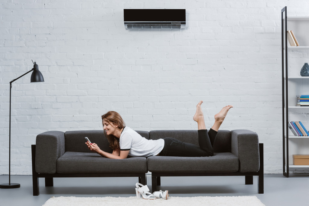 woman living alone lying on her couch