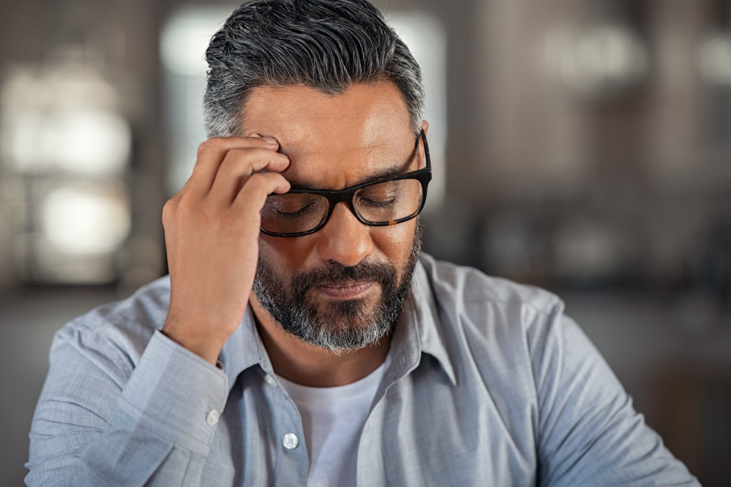 Depressed man at work