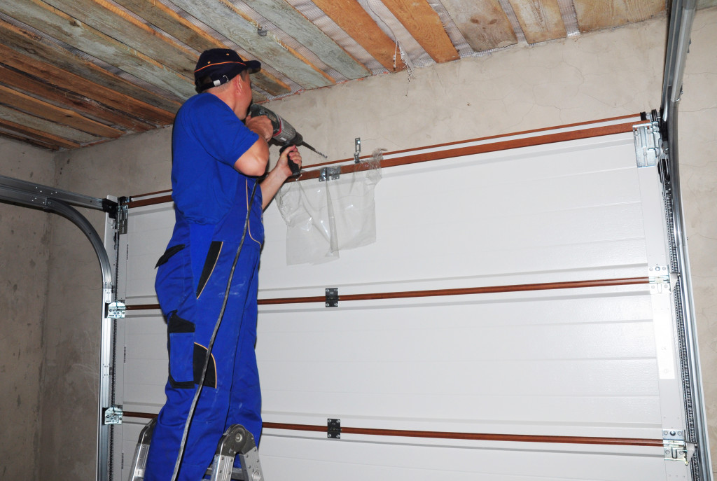 Checking garage door and fixing it