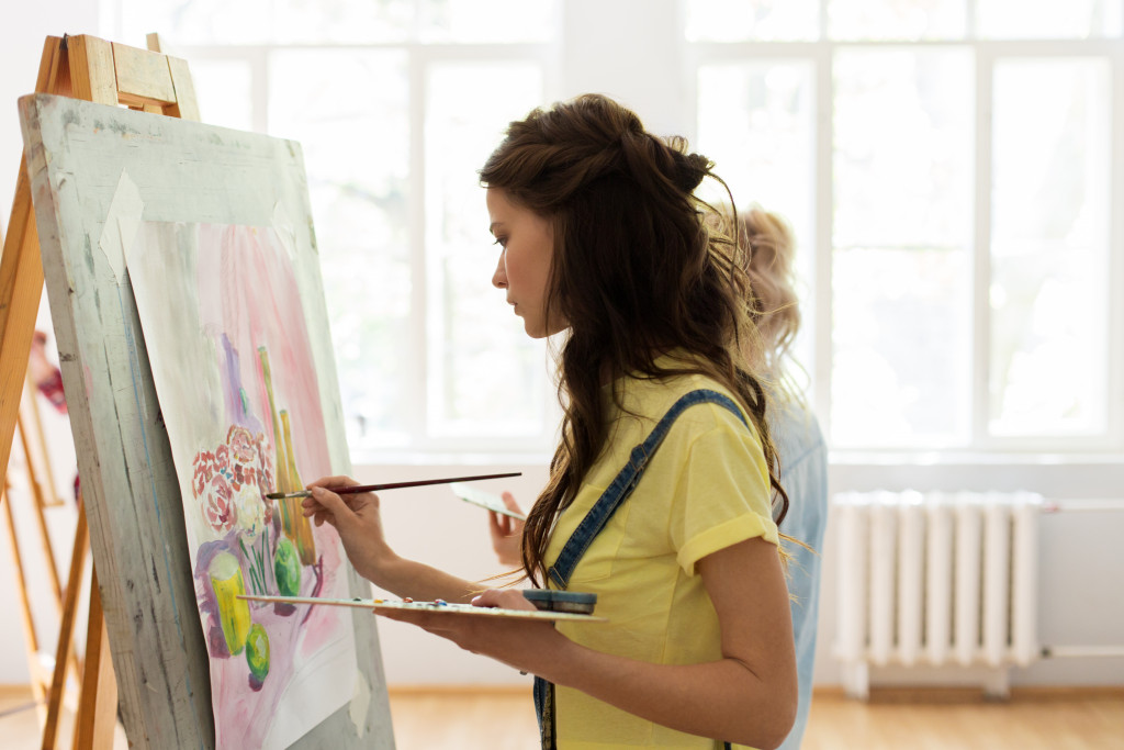 woman painting canvas