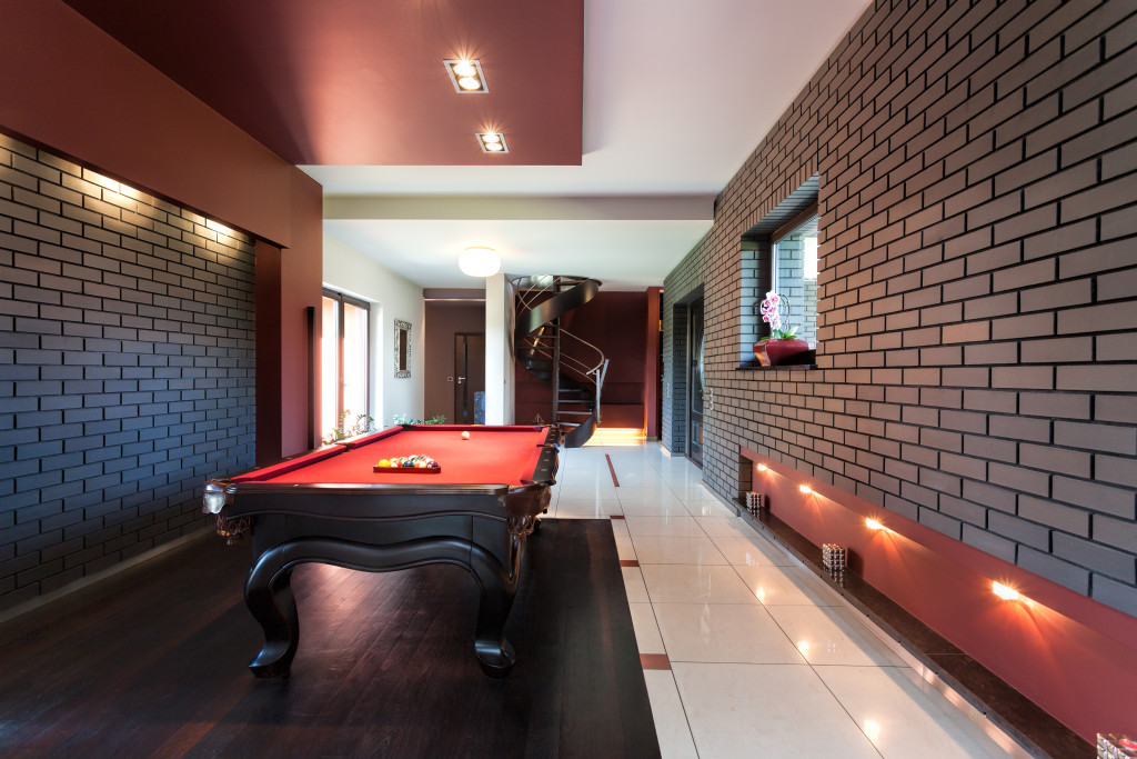 Home basement with a snooker table and luxury interior.