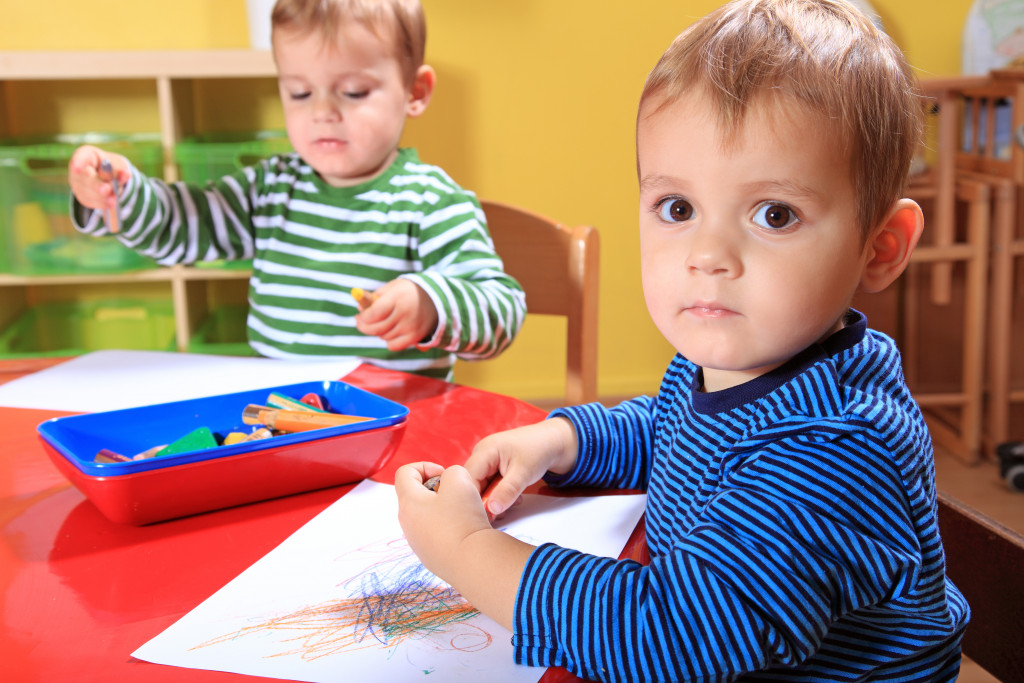 Toddlers working on their own in school.