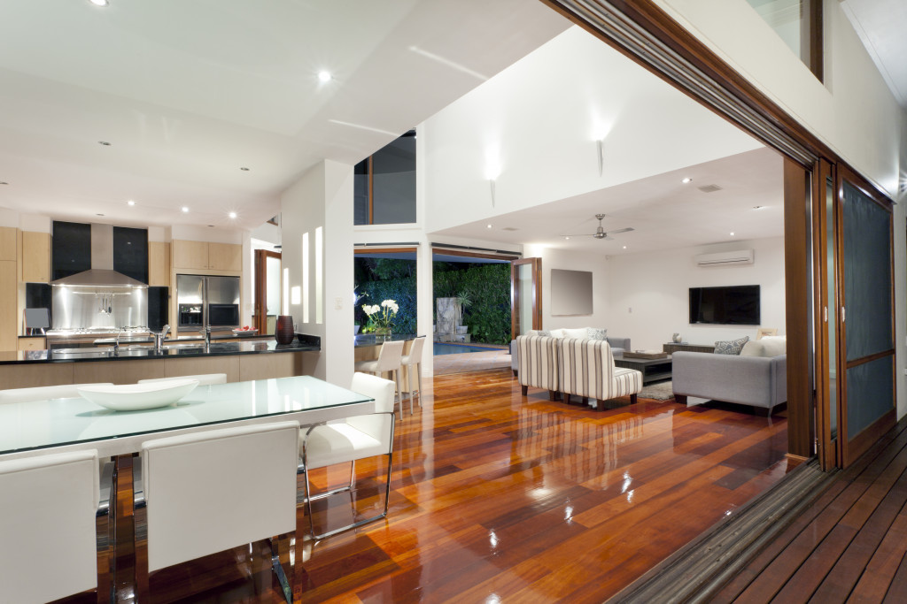 luxury home with large sliding doors and shiny wooden floor